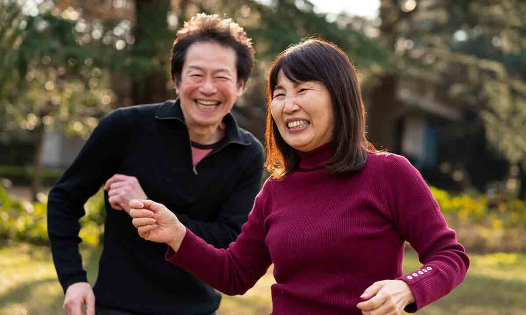 Happy and active older asian couple